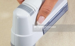 Край на Влакнестите Топчета по Дрехите с Lint Remover